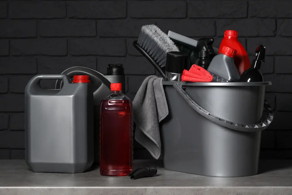 different,car,cleaning,products,on,grey,table,near,black,brick